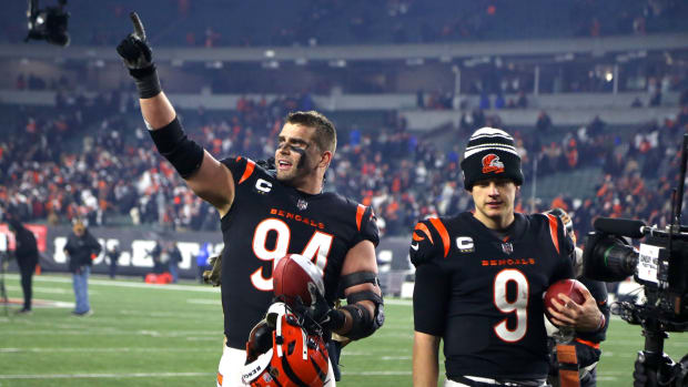 Jan 15, 2023; Cincinnati, Ohio, USA; Cincinnati Bengals defensive end Sam Hubbard (94) and quarterback Joe Burrow (9) walk off the field after defeating the Baltimore Ravens in a wild card game at Paycor Stadium. Mandatory Credit: Joseph Maiorana-USA TODAY Sports